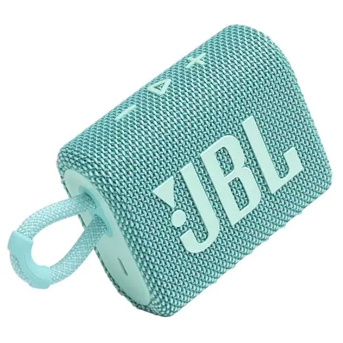 JBL Go 3 mini Bluetooth speaker in teal color on sand